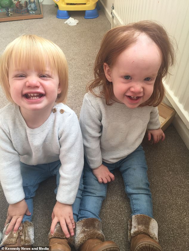 Maisie Saward, 18-months, from Blackfield, Hampshire, crawled into the bathroom unnoticed last Friday evening and shaved her head with hair removal cream (pictured with her twin sister Eva, left)