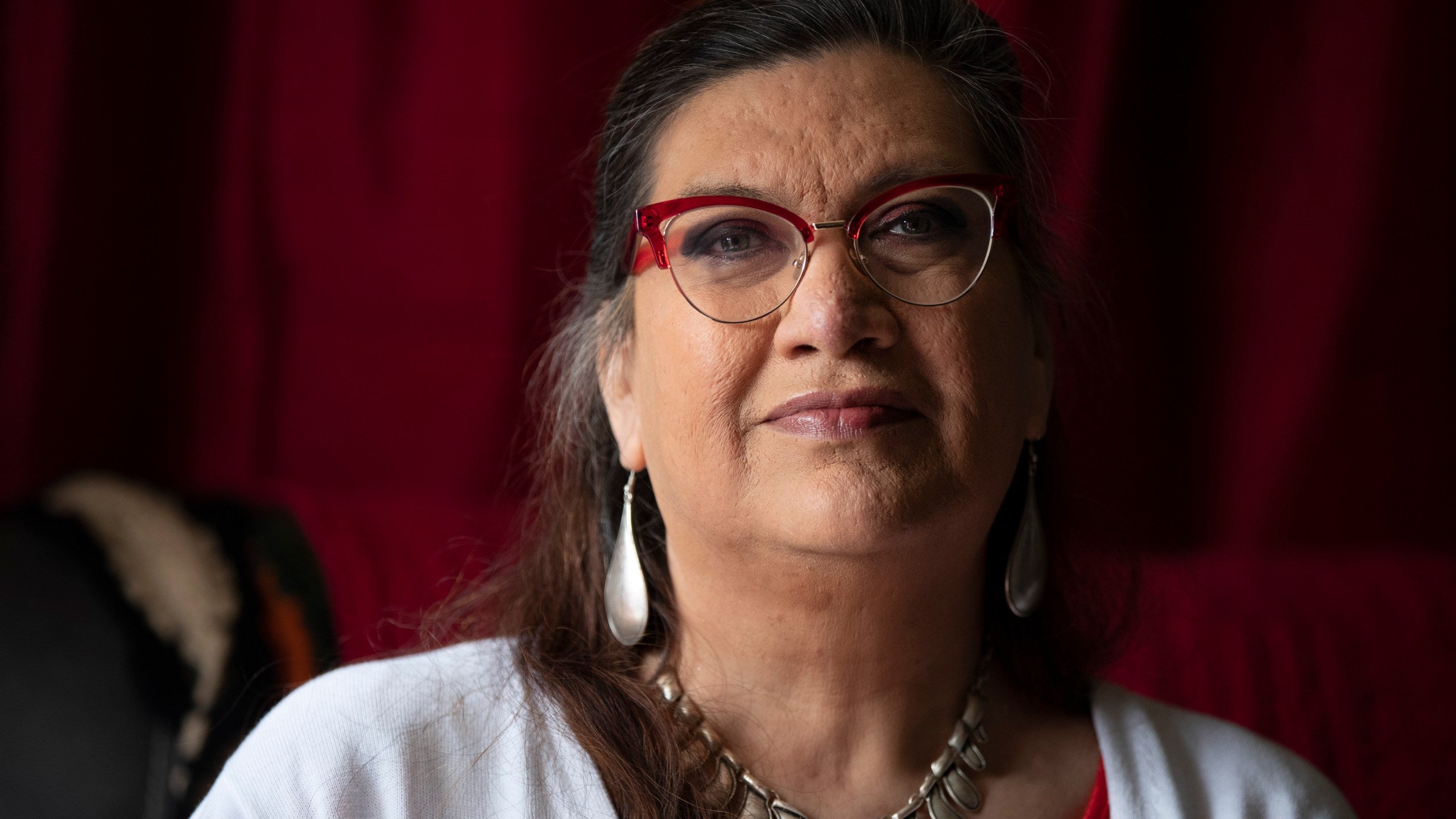 Christina Wood sits for a portrait at her home in Salem, Ore., Friday, April 21, 2023. Six years ago, Wood moved to Oregon, where she could access the …