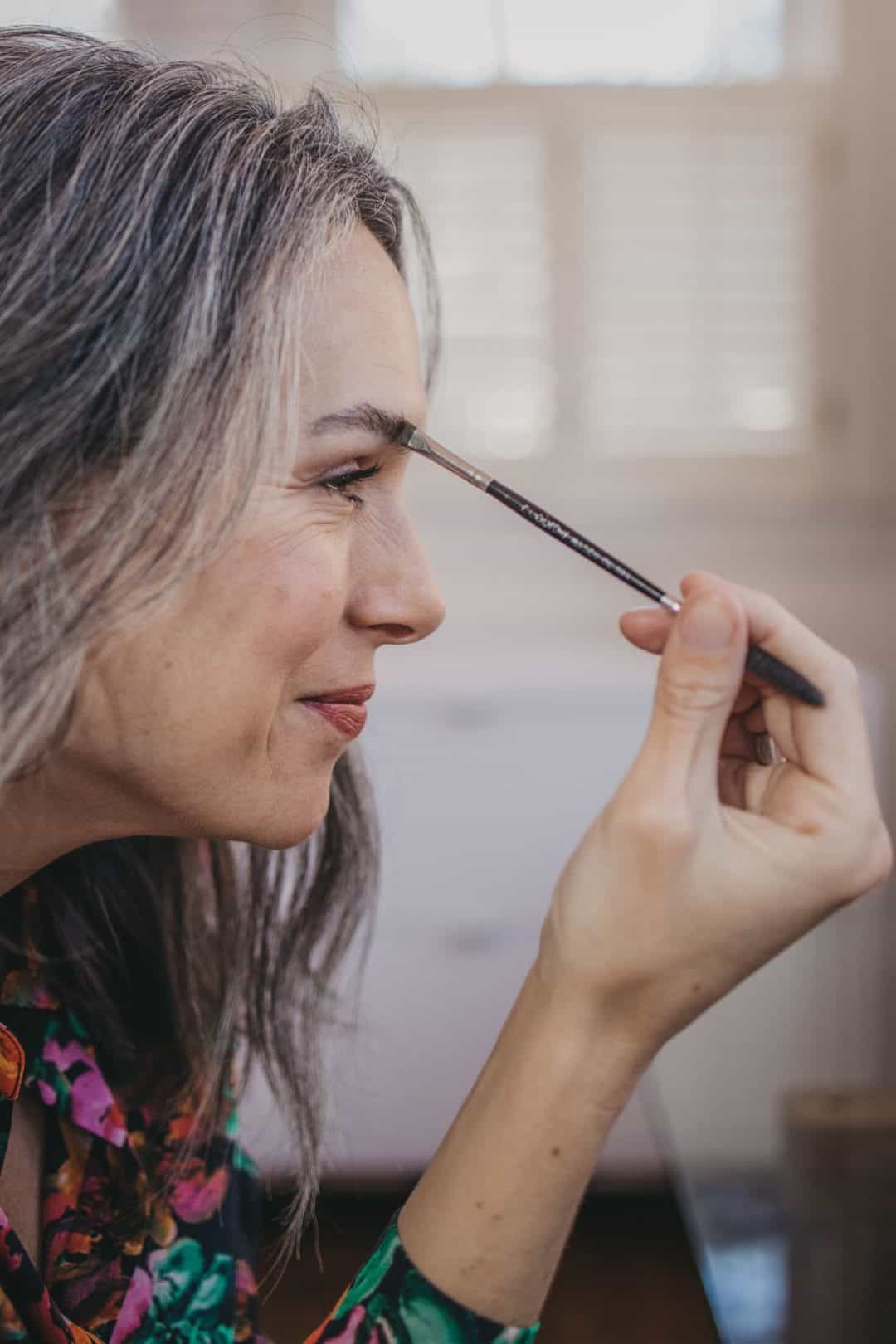 Lisa trying on eyebrow makeup