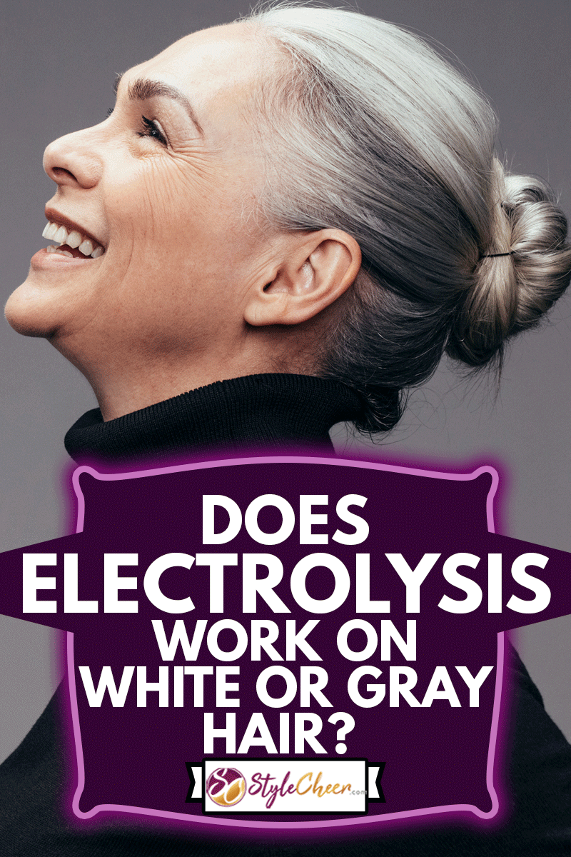 Side view of senior woman laughing on gray background. Profile view of mature woman in black casuals looking happy, Does Electrolysis Work On White Or Gray Hair?