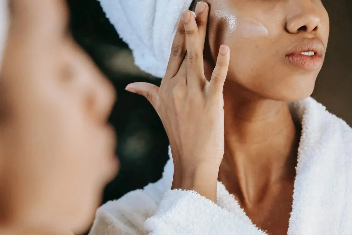 Photo by Sora Shimazaki: https://www.pexels.com/photo/crop-ethnic-woman-applying-cream-on-face-against-mirror-5938242/