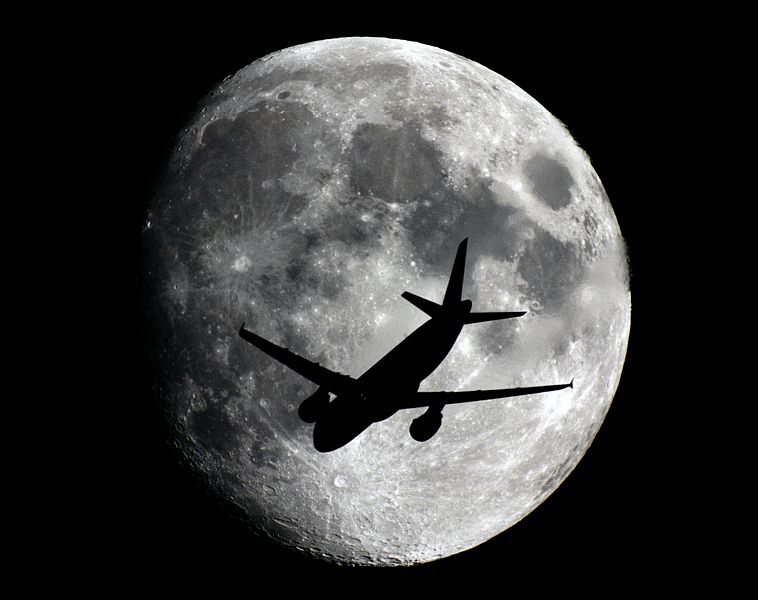 Waxing Gibbous Moon has a visitor, 2013. Photo by Sebastien Lebrigand / Wikimedia Commons.