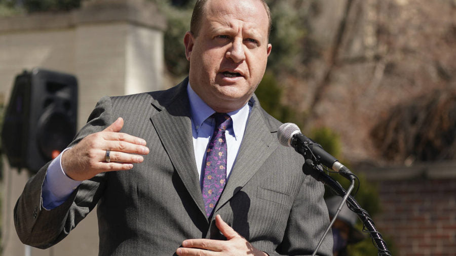 FILE - In this March 10, 2021, file photo, Colorado Gov. Jared Polis speaks during a news conferenc...