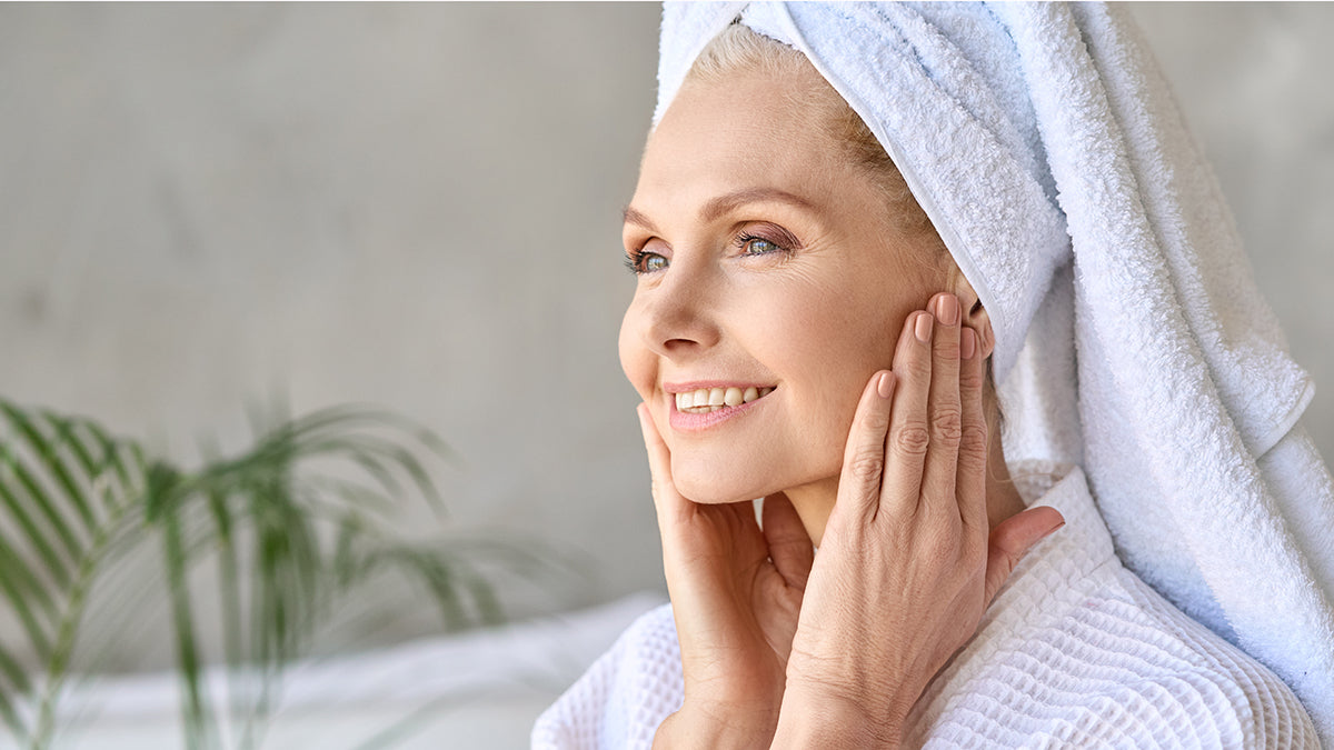 Beautiful woman touching her face that's free of peach fuzz